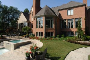 beautiful landscape backyard with pool and spa
