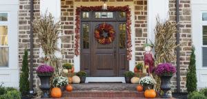 fall garden design with chrysanthemums and pumpkins