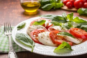 Fresh basil leaves added to a salad in Cincinnati.
