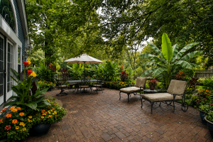 Resort-style summer patio with Northern Wonder banana plants, Cleopatra canna, hibiscus, and cozy wicker seating