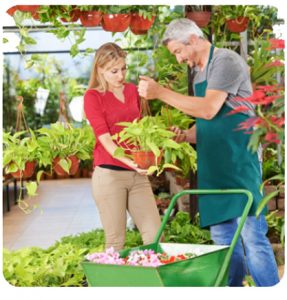 Woman buying plants at nursery